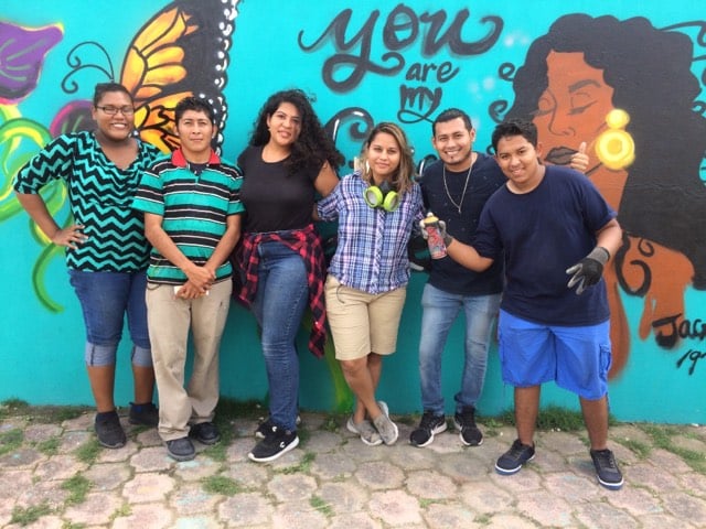 Christy Carillo and mural students in Corozal