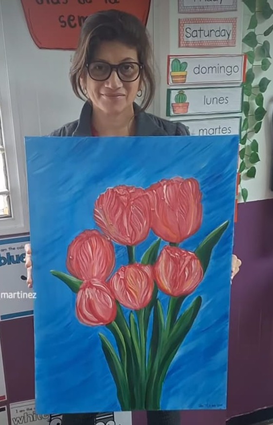 Gianni Martinez with her painting